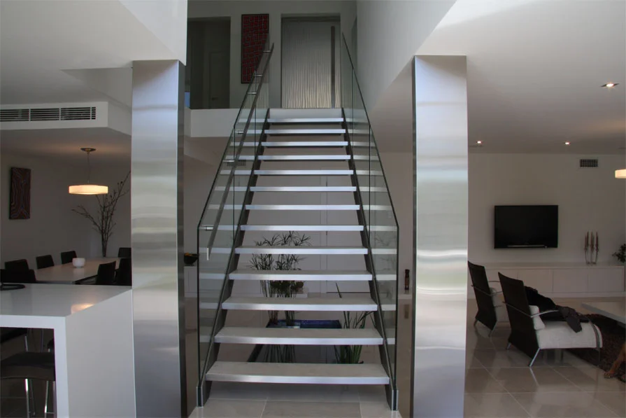 Modern stainless steel staircase balustrade with horizontal rails fabricated by A&E Metal Craft for Sydney residential project
