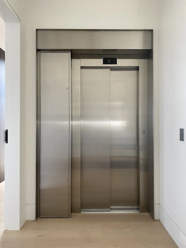 Commercial grade stainless steel elevator lift surround cladding with precision fabrication and seamless finish - North Shore Sydney commercial metalwork by A&E Metal Craft