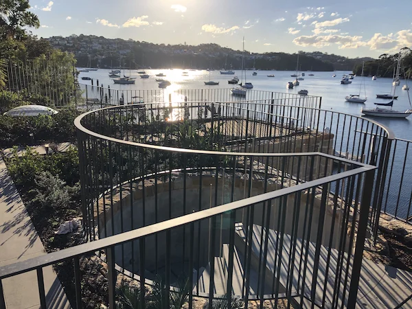 North Shore curved architectural steel balustrade with waterfront harbour views - custom precision metalwork by A&E Metal Craft