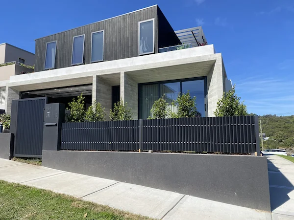 Northern Beaches custom steel fabricated gate and fence with modern vertical slat design - premium residential powder-coated metalwork by A&E Metal Craft featuring contemporary coastal styling and security functionality