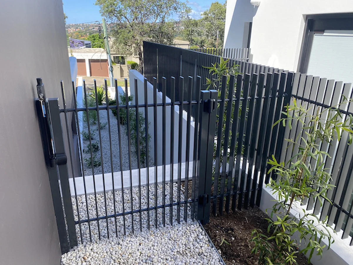 Custom steel gate and fence system with security features for Sydney residential property - professional fabrication by A&E Metal Craft
